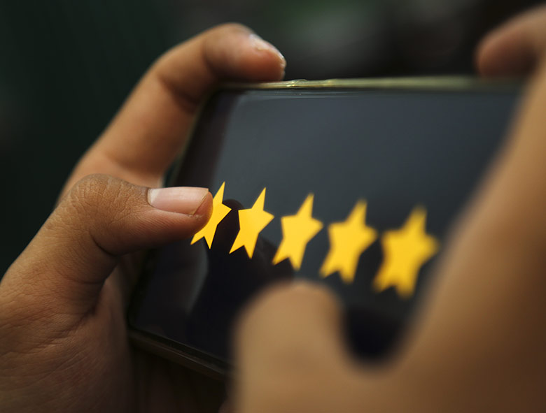 Photo of a 5 star review on mobile phone